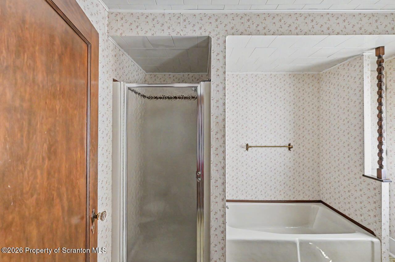 502 Layton Road Clarks Summit, PA 18411 - Photo 29 of 42 a bathroom with a glass shower door
