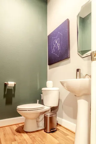 a bathroom with a toilet and a sink