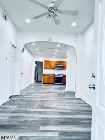 a room with an entryway and chandelier