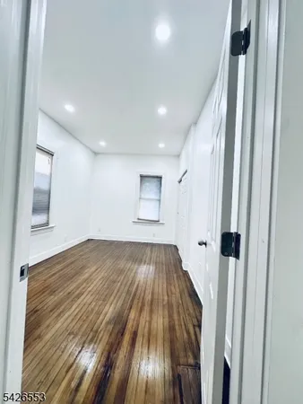 a view of wooden floor in an empty room