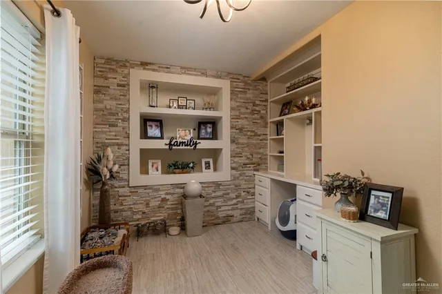 a room with a cabinets and a window