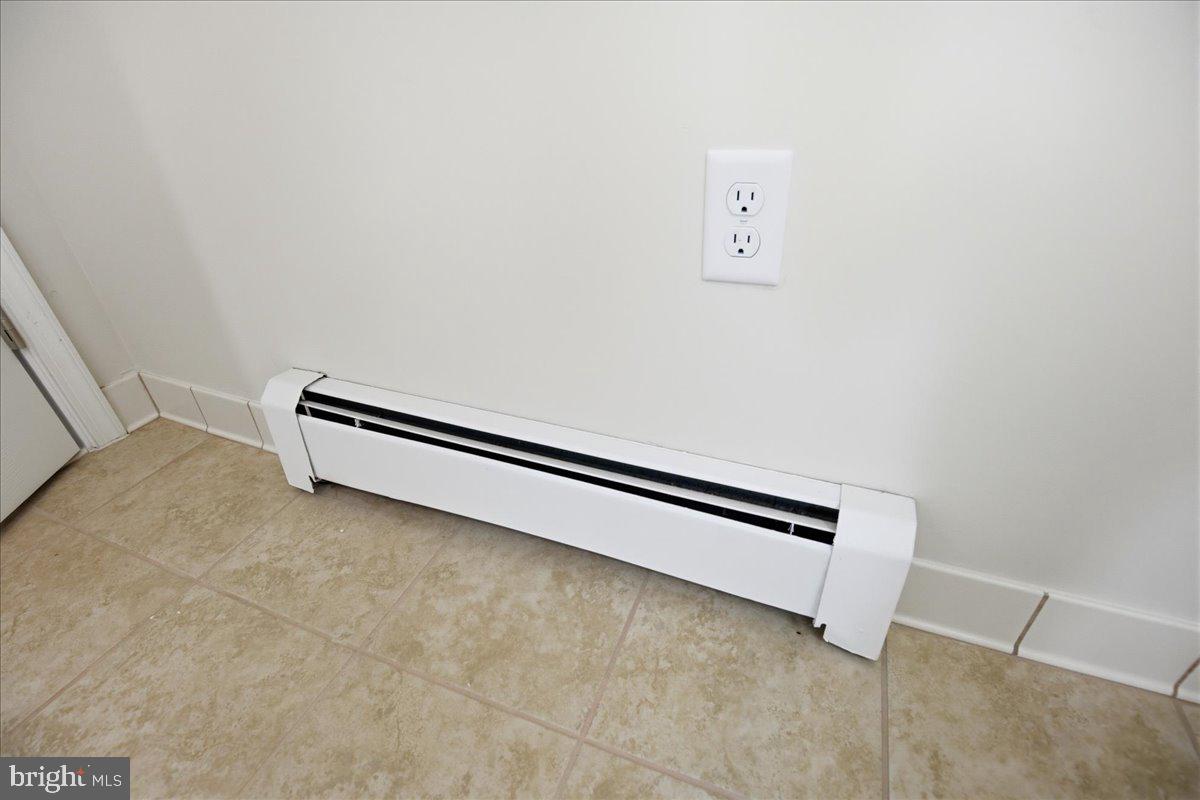 38125 Louis Thomas Road Avenue, MD 20609 - Photo 38 of 73 PRIMARY BATHROOM NEW TITLE FLOORING 2026 YR