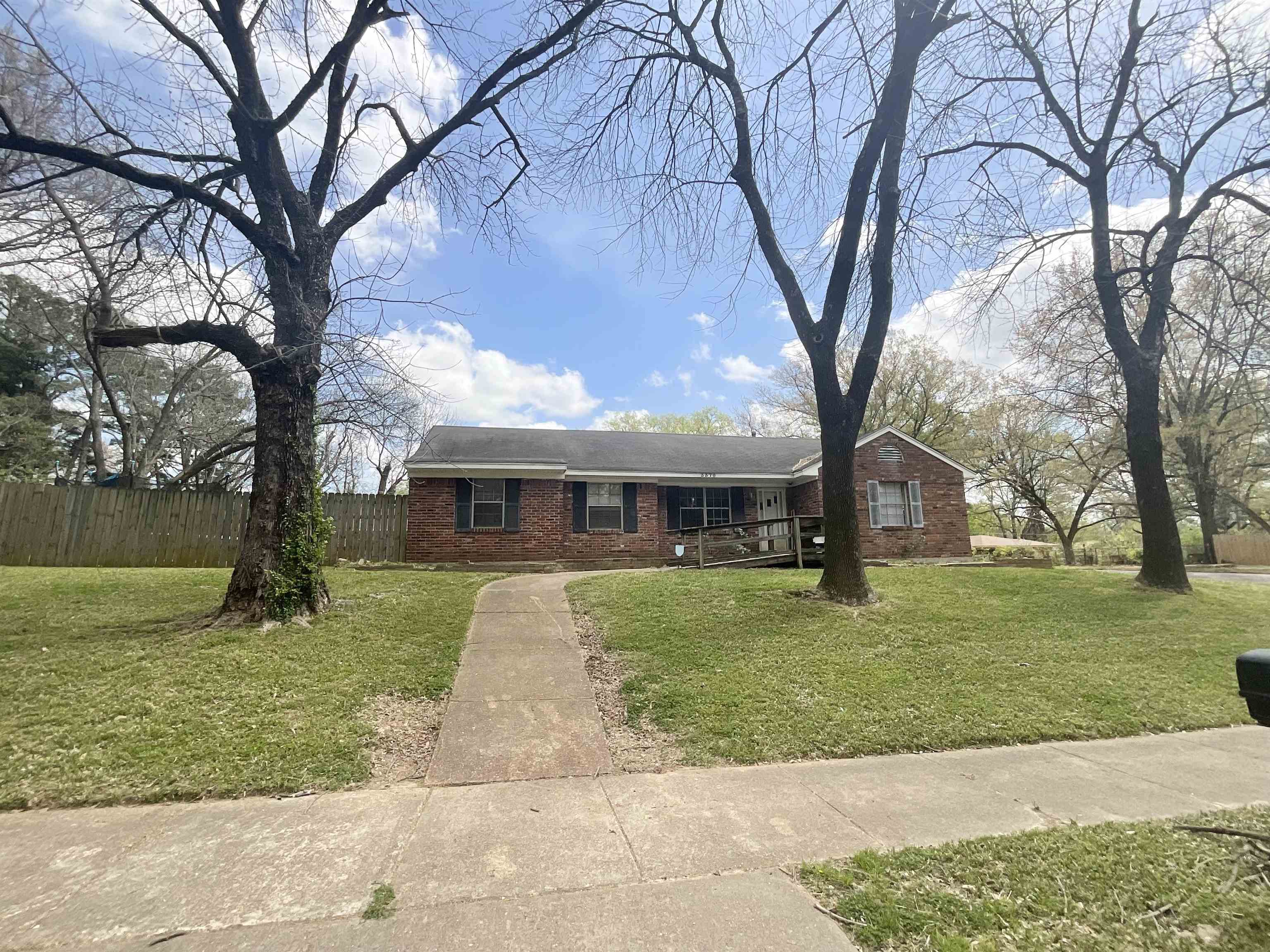 3370 Debby Street Memphis, TN 38127 - Photo 2 of 8 a front view of a house with garden