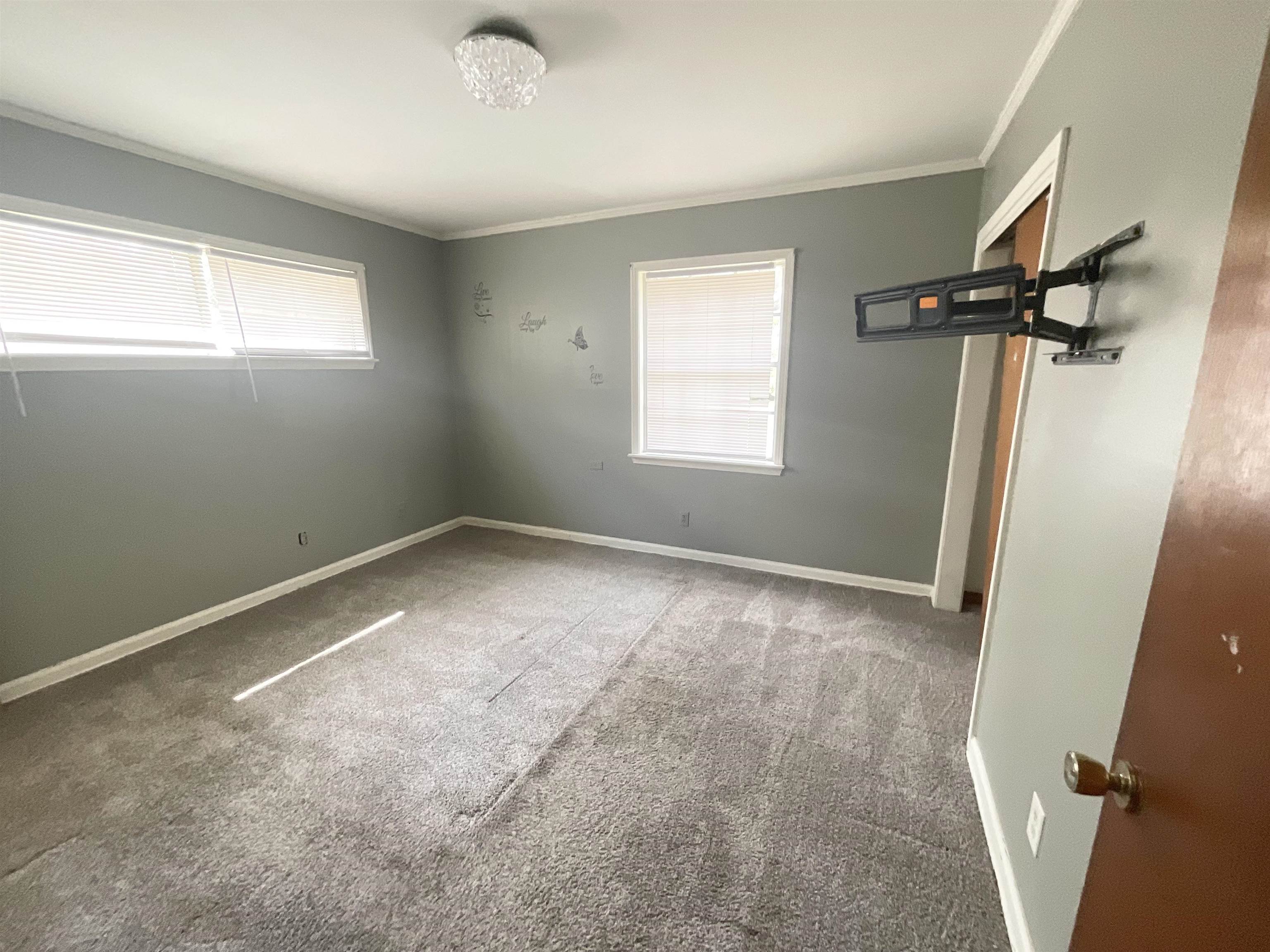 3370 Debby Street Memphis, TN 38127 - Photo 7 of 8 an empty room with windows