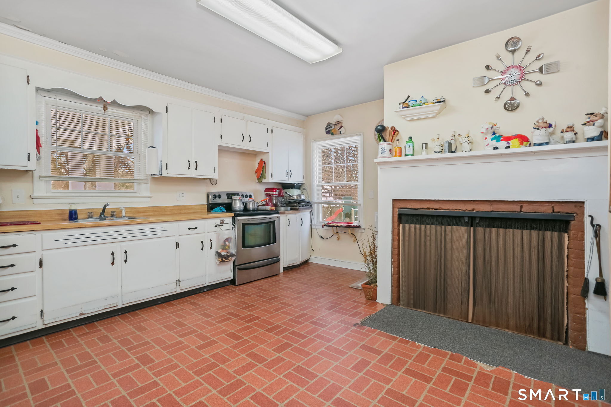 877 White Plains Road Trumbull, CT 06611 - Photo 11 of 33 a kitchen with stainless steel appliances granite countertop a refrigerator sink and cabinets