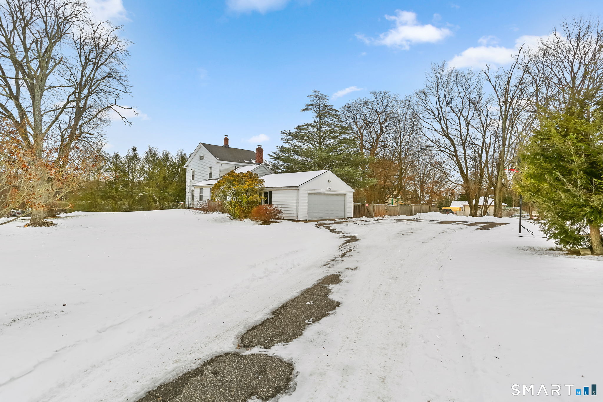 877 White Plains Road Trumbull, CT 06611 - Photo 2 of 33 a view of road with large trees