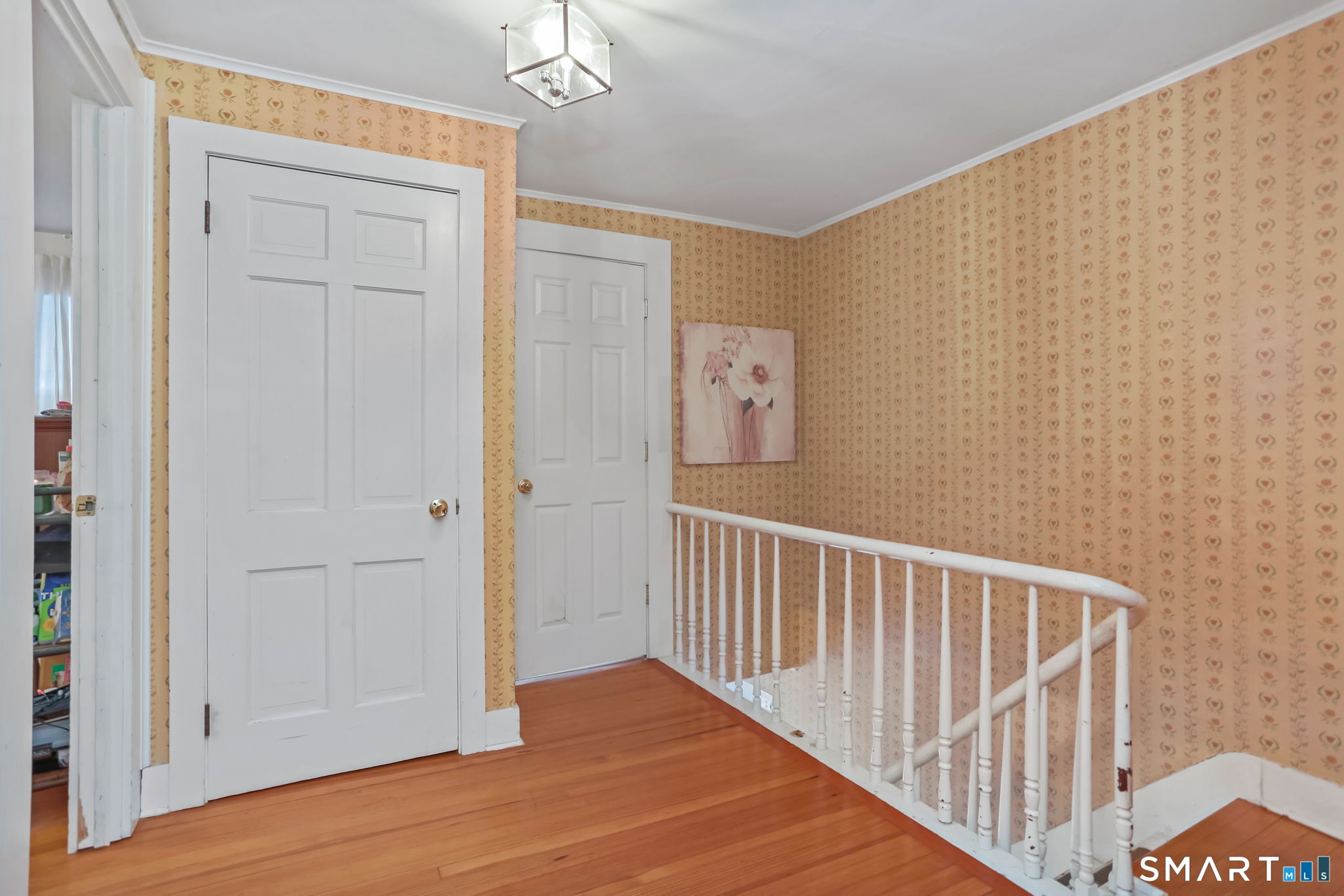 877 White Plains Road Trumbull, CT 06611 - Photo 22 of 33 a view of a hallway with wooden floor