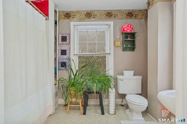 a bathroom with a sink a mirror and a shower
