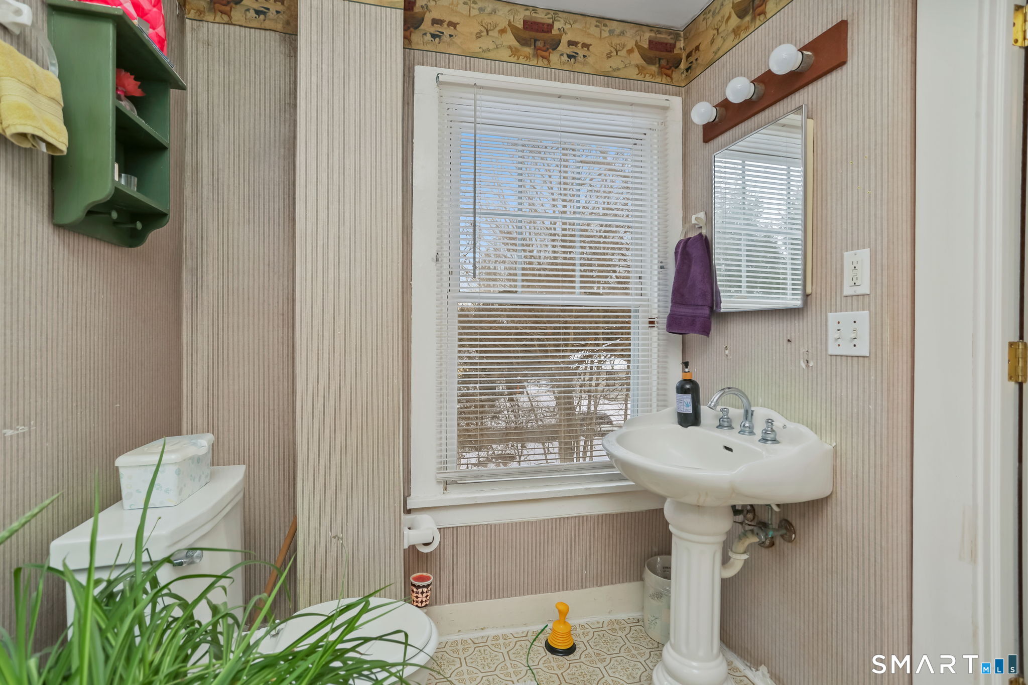 877 White Plains Road Trumbull, CT 06611 - Photo 24 of 33 a bathroom with a sink a mirror and a shower