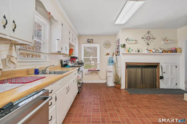 a kitchen with stainless steel appliances granite countertop a sink and cabinets