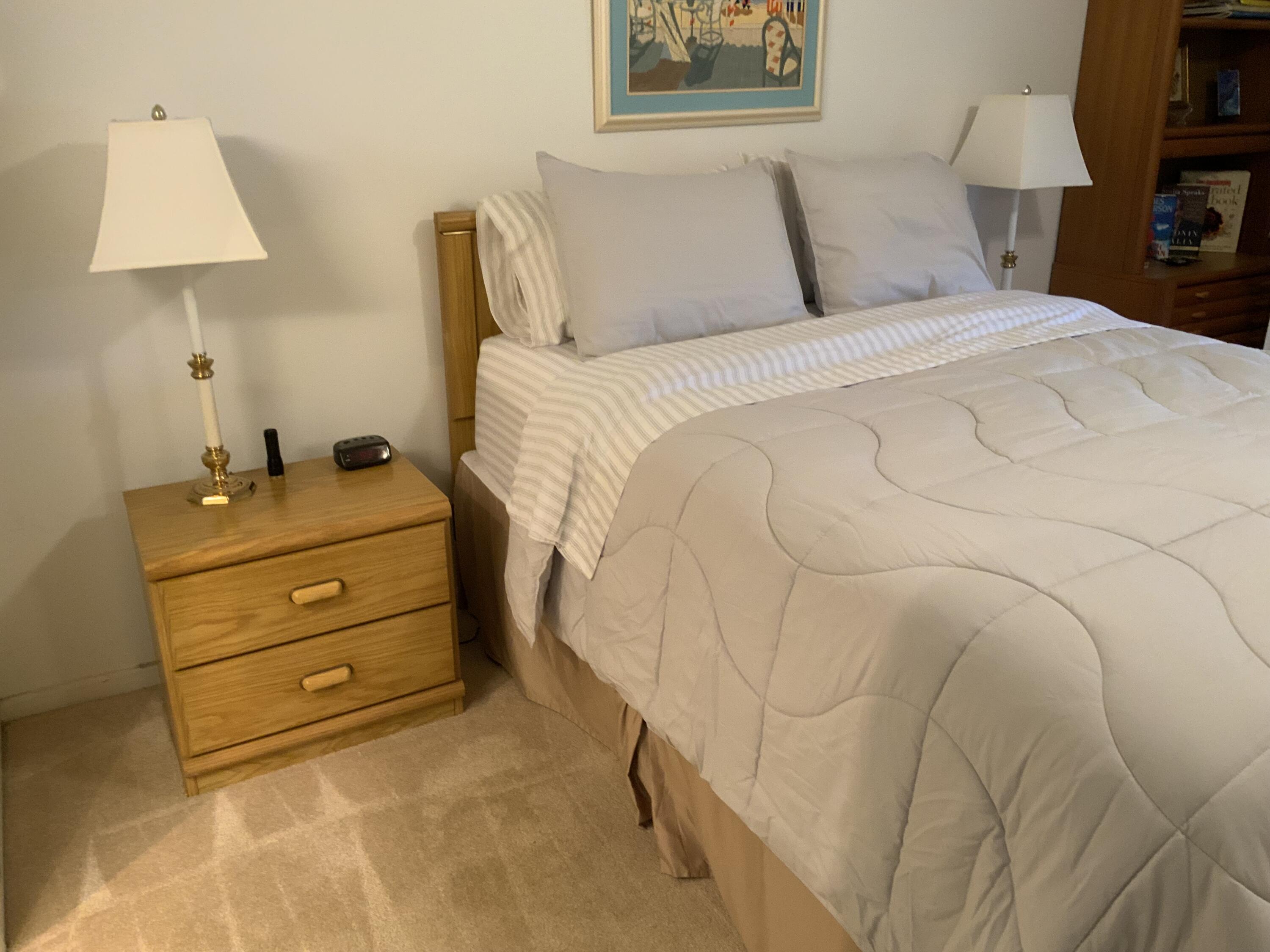 2050 Hythe A Boca Raton, FL 33434 - Photo 13 of 20 a bedroom with a bed and a night stand