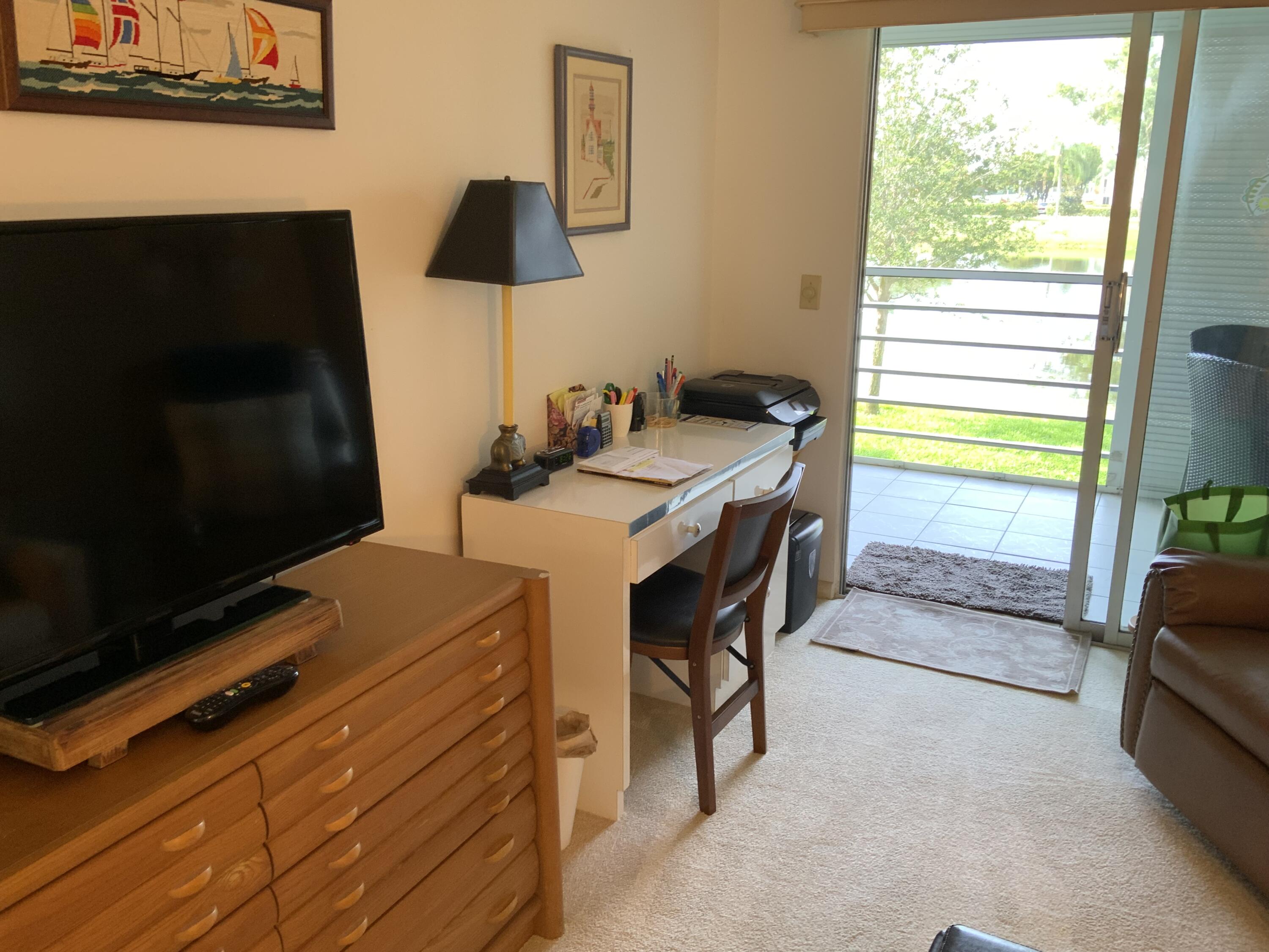 2050 Hythe A Boca Raton, FL 33434 - Photo 8 of 20 a room with furniture and a flat screen tv