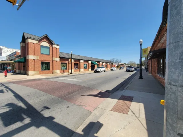 a view of multiple houses with city street