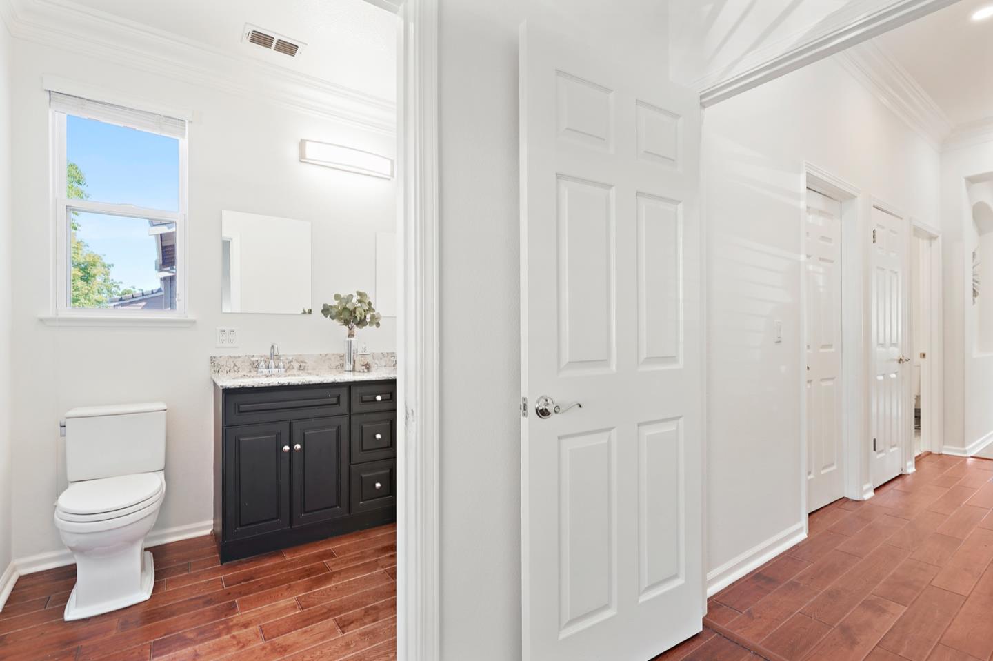 3066 Grey Eagle Drive Walnut Creek, CA 94595 - Photo 30 of 47 a bathroom with a toilet a sink and mirror