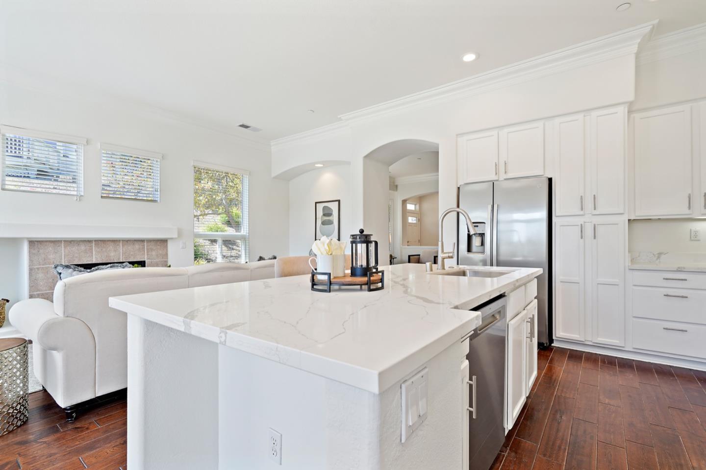 3066 Grey Eagle Drive Walnut Creek, CA 94595 - Photo 6 of 47 a large kitchen with sink a refrigerator and wooden floor