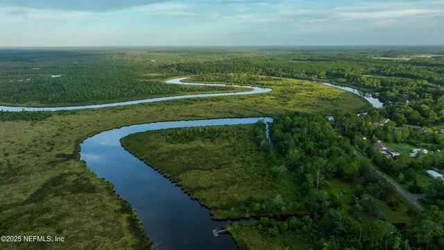a view of a golf course with a lake