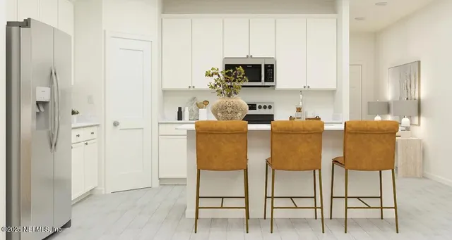 a dining room with furniture a sink and a window