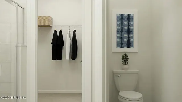 a bathroom with a toilet sink and shower