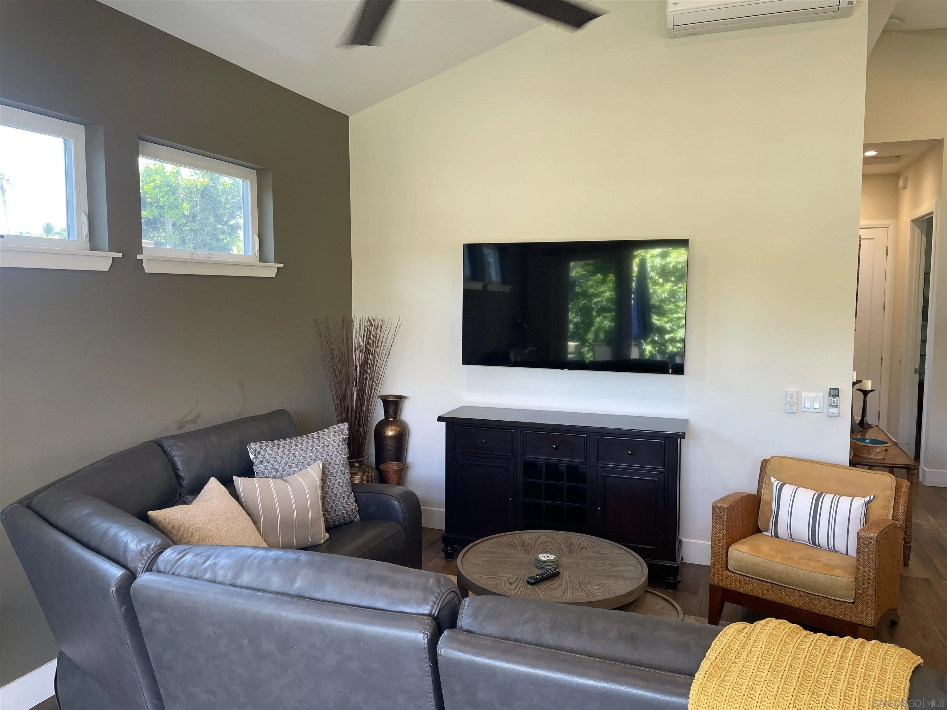 327 Cole Ranch Road Encinitas, CA 92024 - Photo 11 of 22 a living room with furniture a flat screen tv and a fireplace