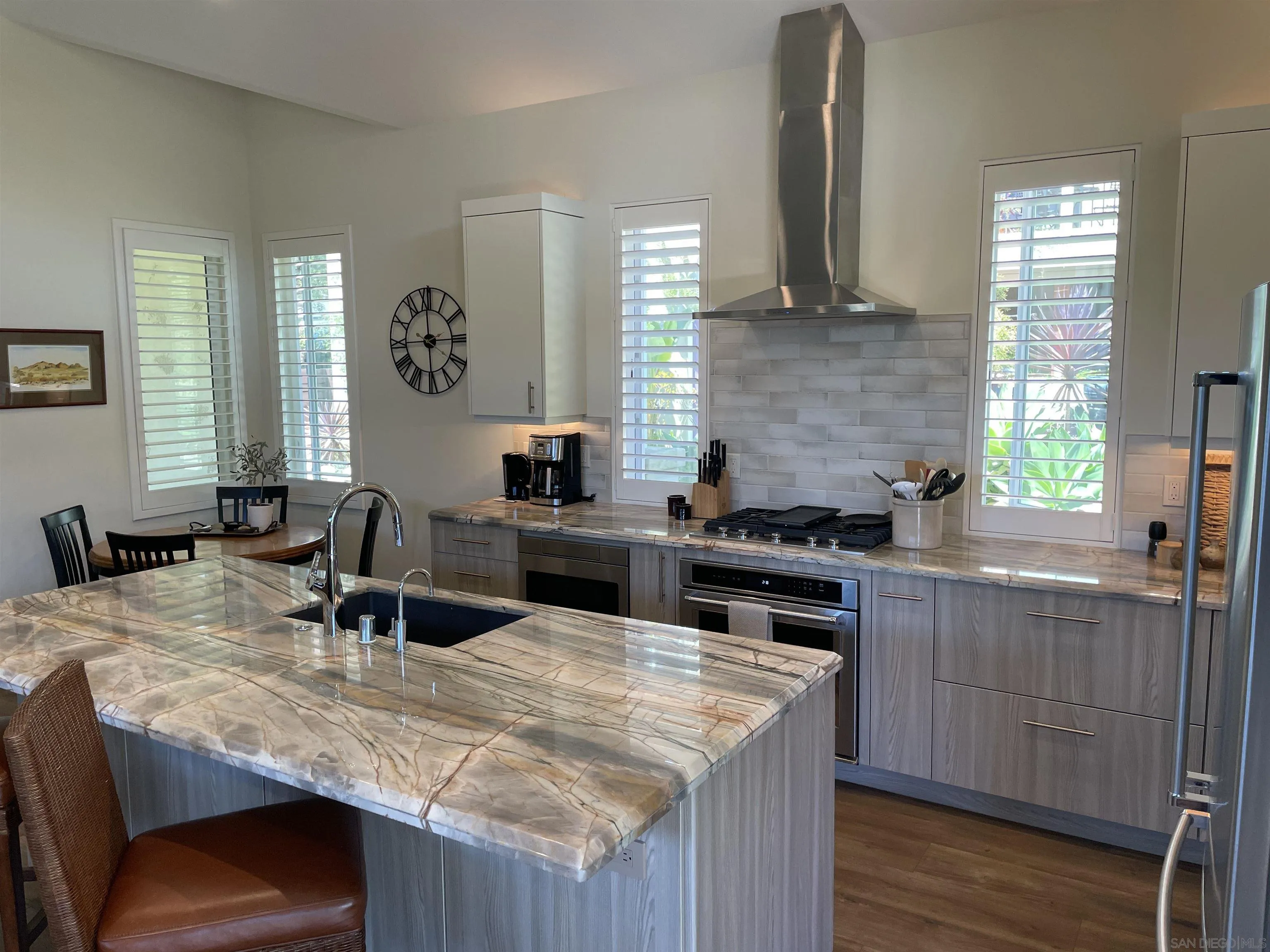 327 Cole Ranch Road Encinitas, CA 92024 - Photo 6 of 22 a kitchen with a stove and a wooden floors