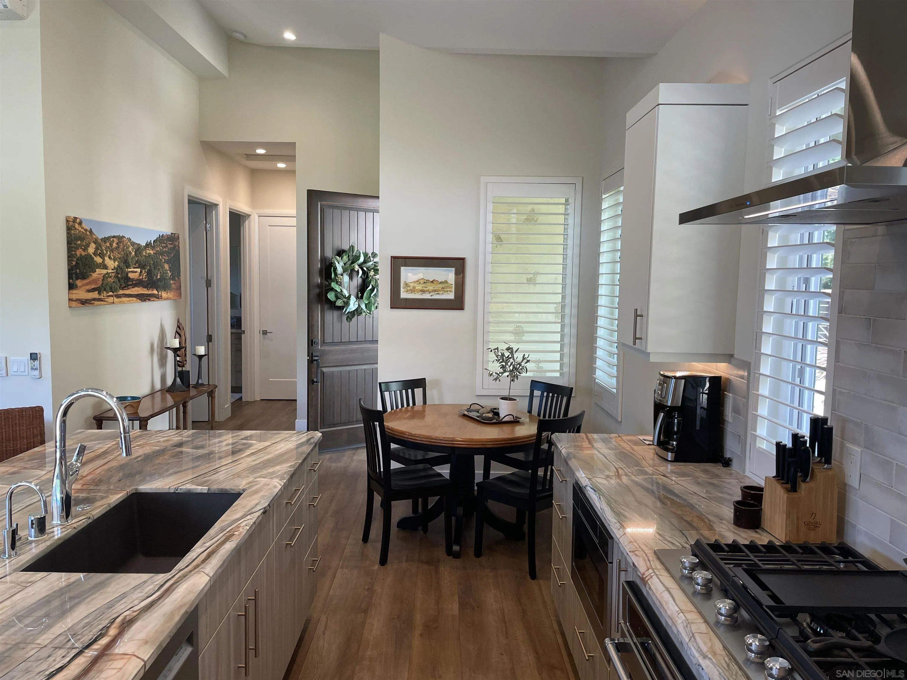 327 Cole Ranch Road Encinitas, CA 92024 - Photo 7 of 22 a kitchen with a table and chairs in it