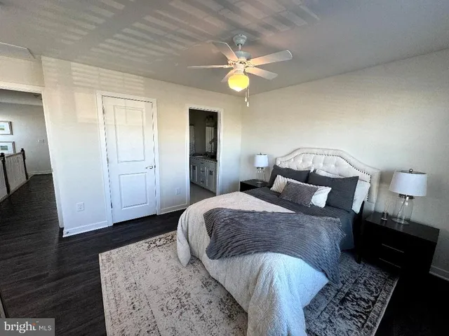 a bed room with a bed and a lamp