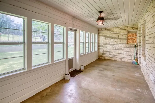 a view of an empty room and a window
