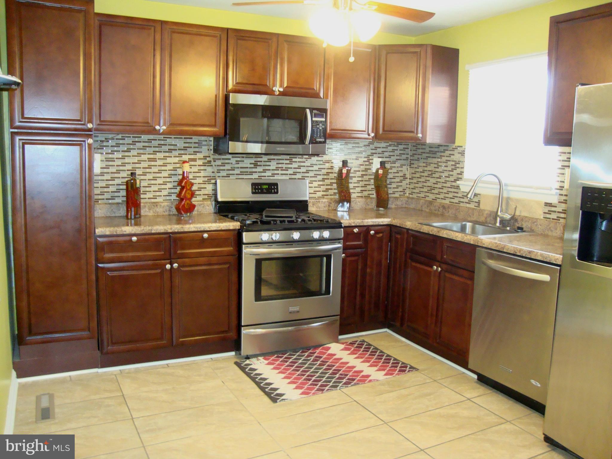 328 Laburnum Road Edgewood, MD 21040 - Photo 4 of 41 Cherry Cabinets Porcelain Tile Floor