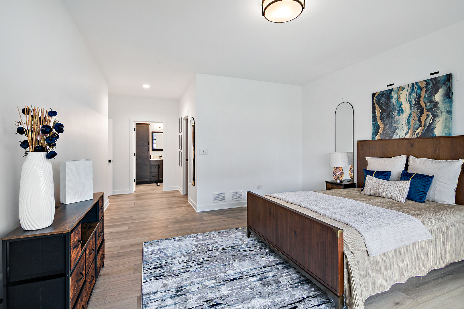 2037 Isabella Lane Minooka, IL 60447 - Photo 22 of 29 a spacious bedroom with a bed and a table