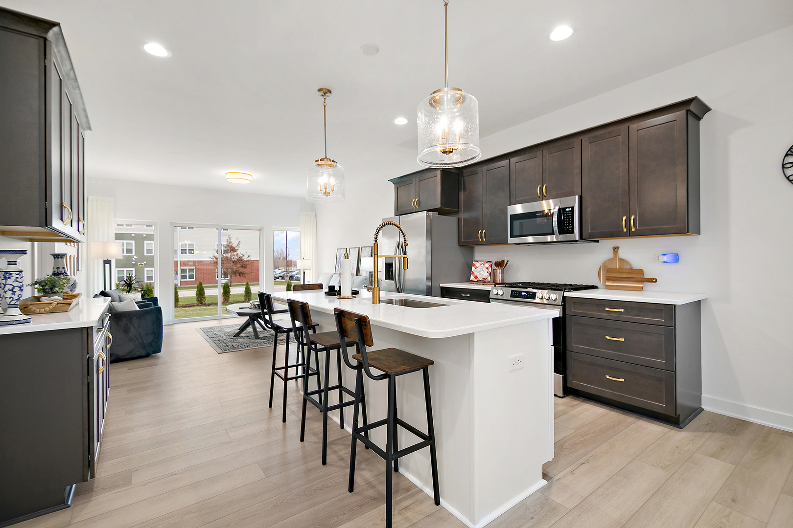 2037 Isabella Lane Minooka, IL 60447 - Photo 6 of 29 a kitchen with a sink a counter top space appliances and cabinets