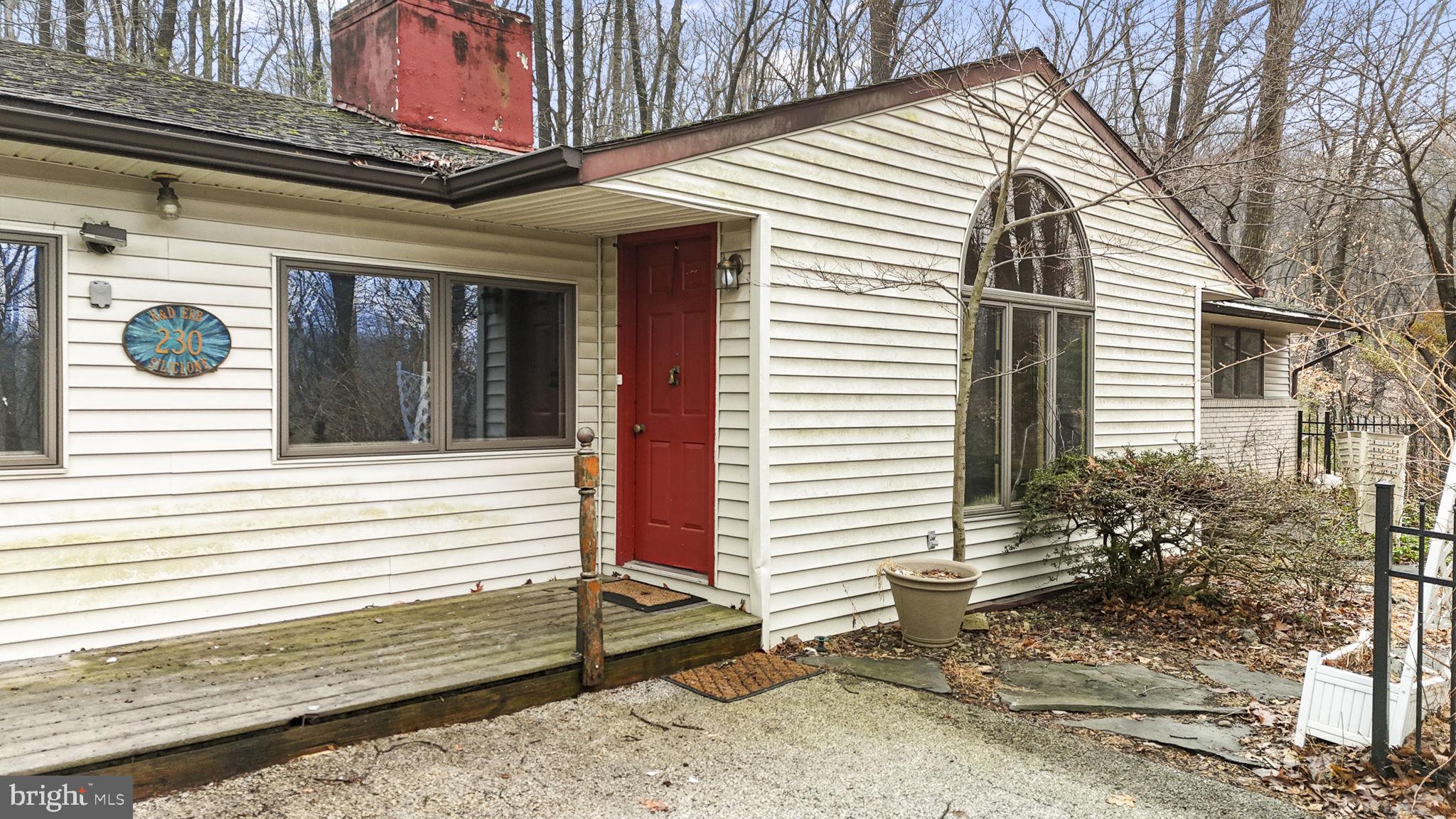 230 Jug Hollow Road Phoenixville, PA 19460 - Photo 2 of 60 a view of a porch with a bench