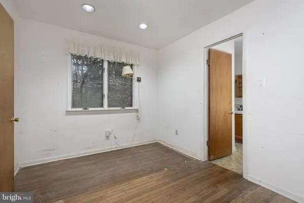 a view of an empty room with wooden walls
