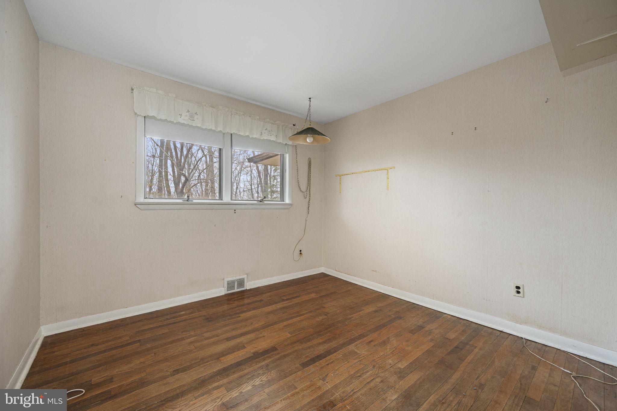 230 Jug Hollow Road Phoenixville, PA 19460 - Photo 23 of 60 a view of a room with wooden floor and window