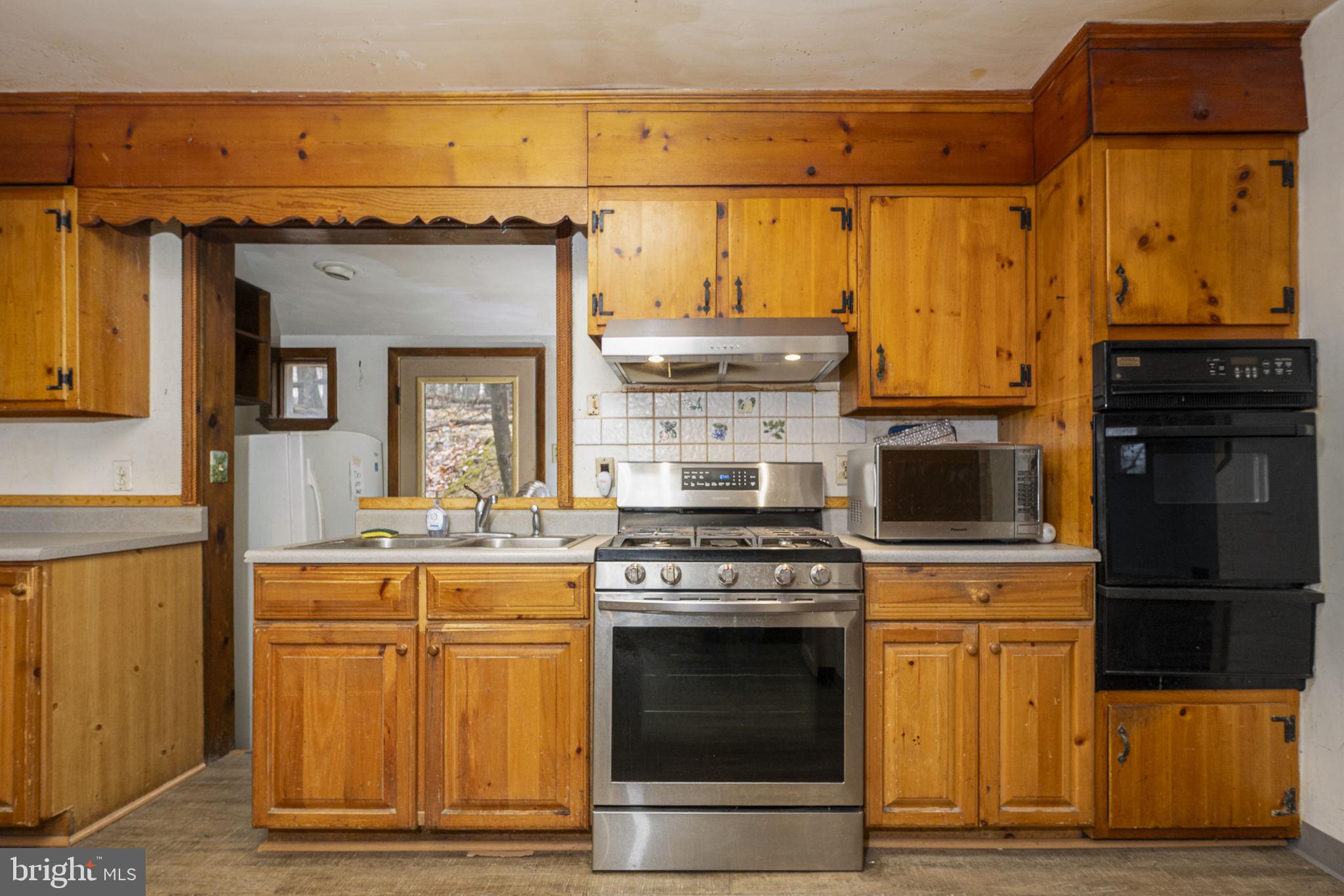 230 Jug Hollow Road Phoenixville, PA 19460 - Photo 7 of 60 a kitchen with stainless steel appliances granite countertop a stove and a refrigerator
