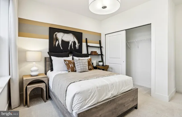 a bedroom with a large bed and a window