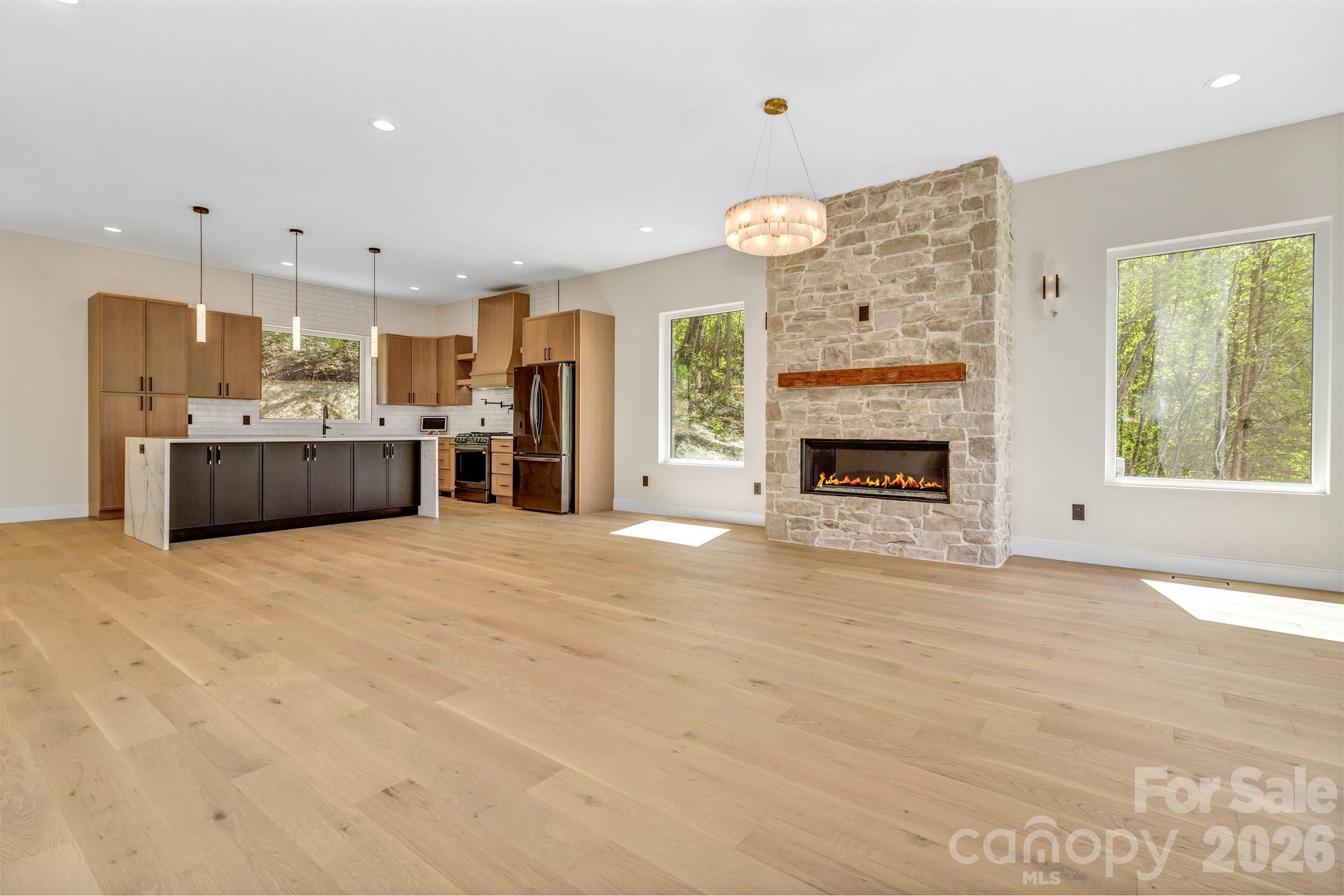 134 View Ridge Parkway Leicester, NC 28748 - Photo 6 of 48 a large kitchen with a fireplace in it