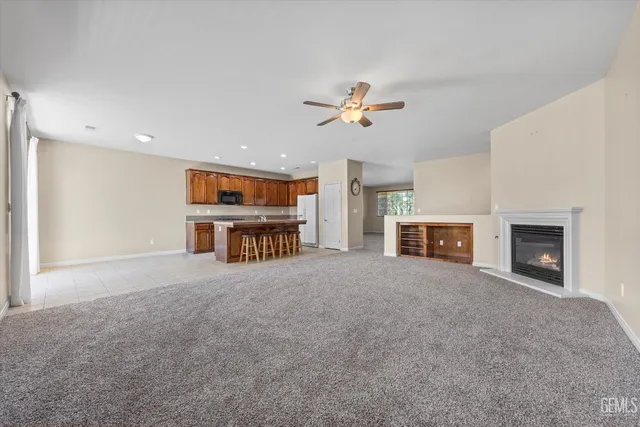 a view of a room with furniture and a window