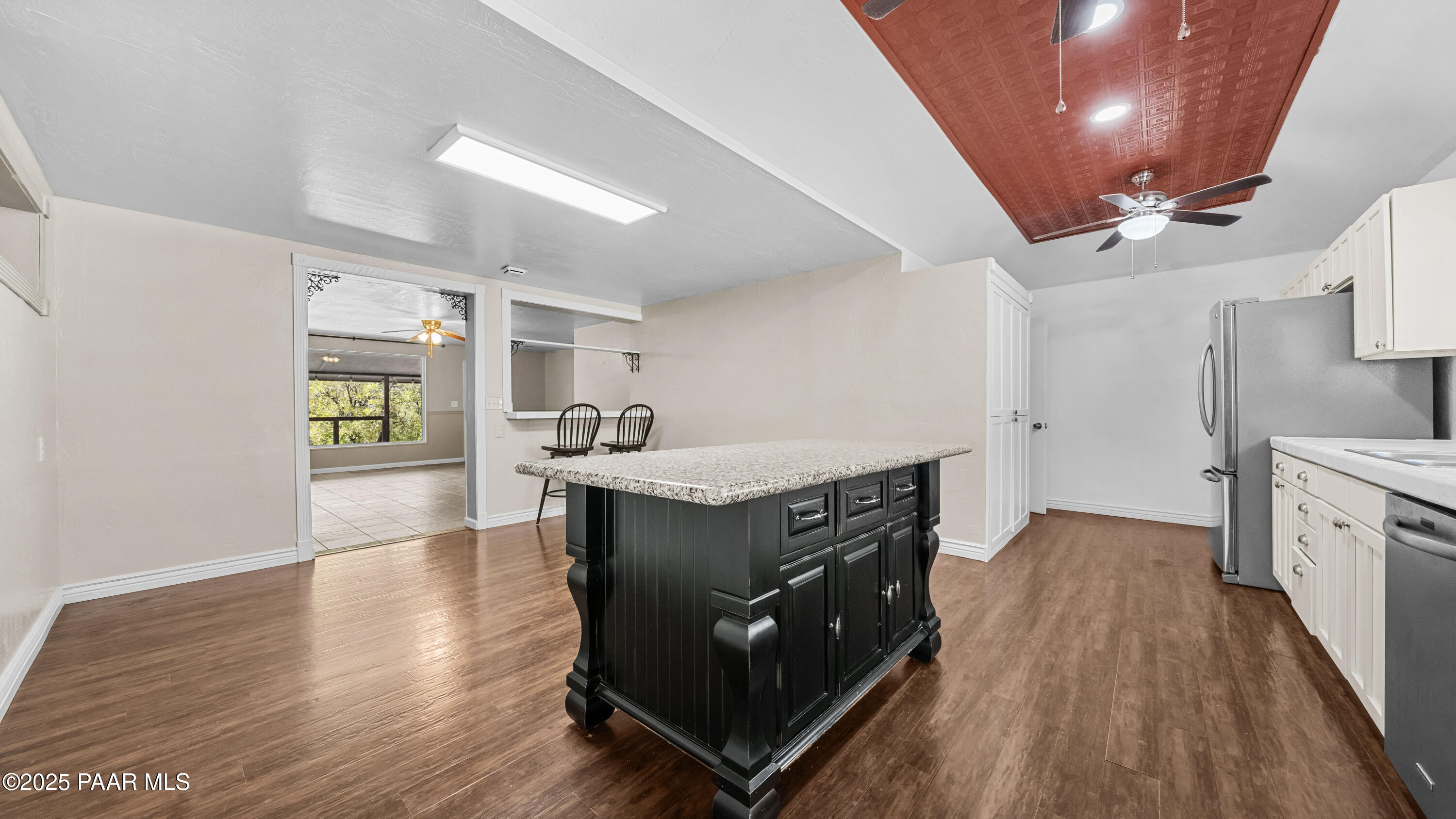 249 South Lynx Creek Road Prescott, AZ 86303 - Photo 13 of 124 a kitchen with stainless steel appliances granite countertop a stove and a refrigerator