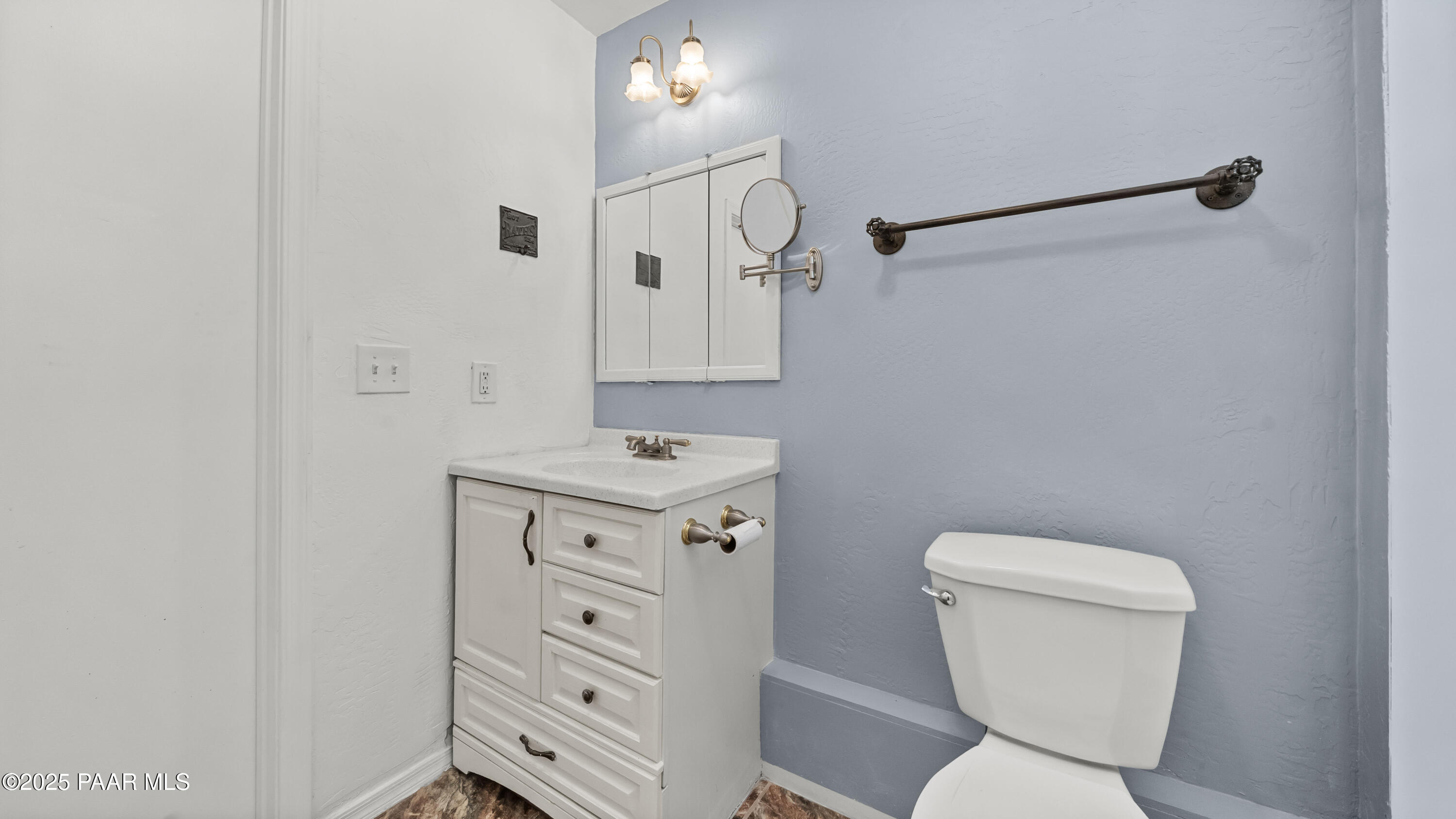 249 South Lynx Creek Road Prescott, AZ 86303 - Photo 28 of 124 a bathroom with a toilet sink and mirror