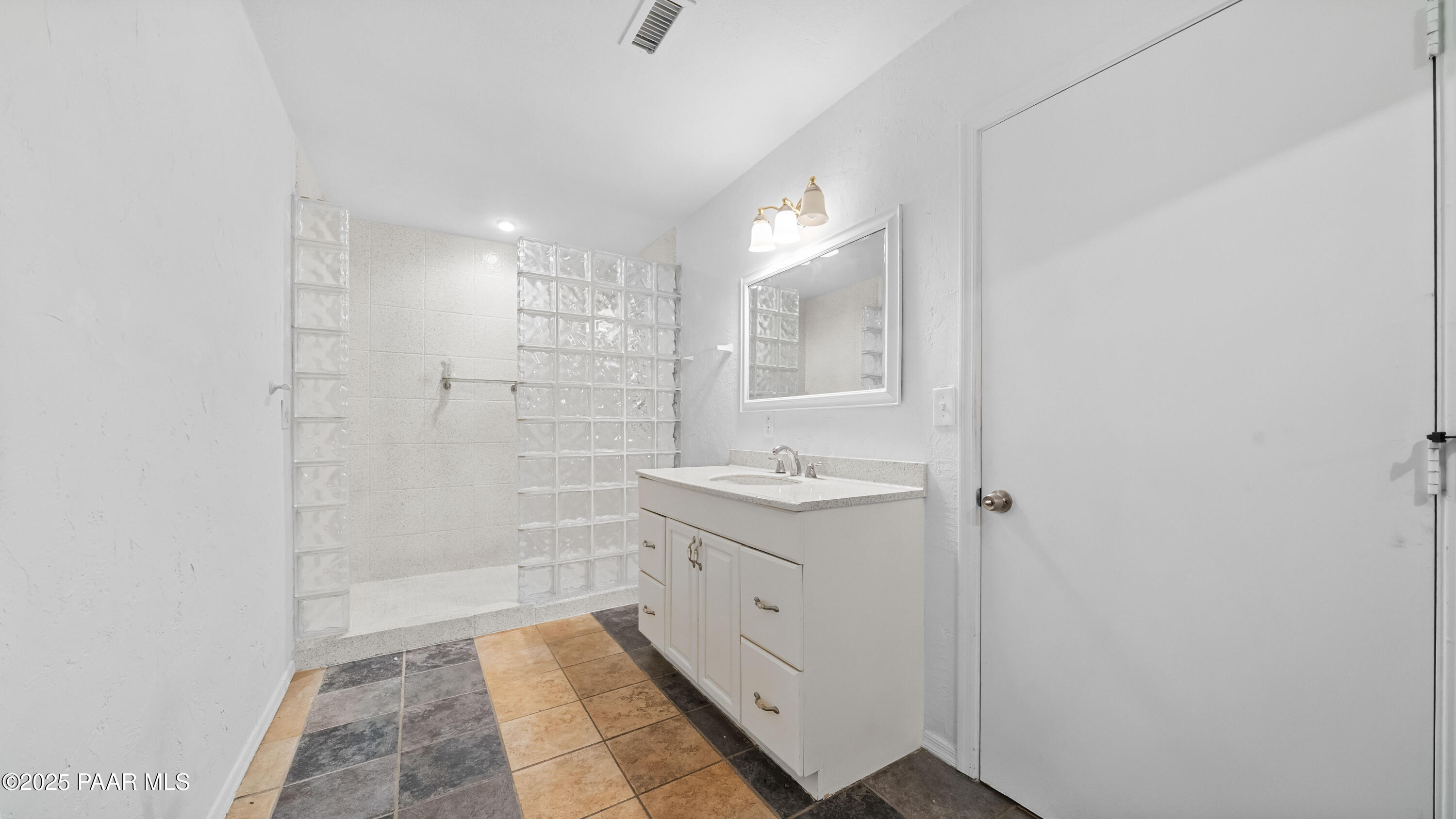 249 South Lynx Creek Road Prescott, AZ 86303 - Photo 37 of 124 a bathroom with a granite countertop sink a toilet and shower