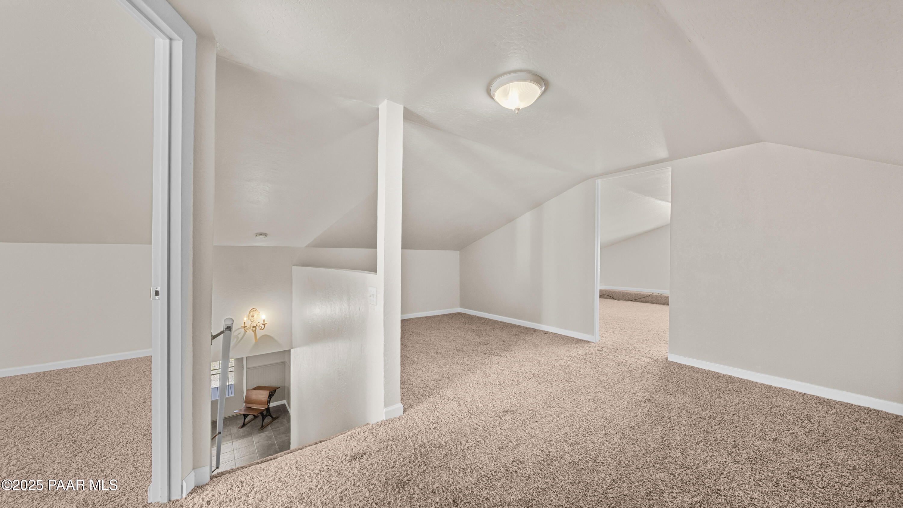 249 South Lynx Creek Road Prescott, AZ 86303 - Photo 43 of 124 an empty room with an entryway and hall with wooden floor