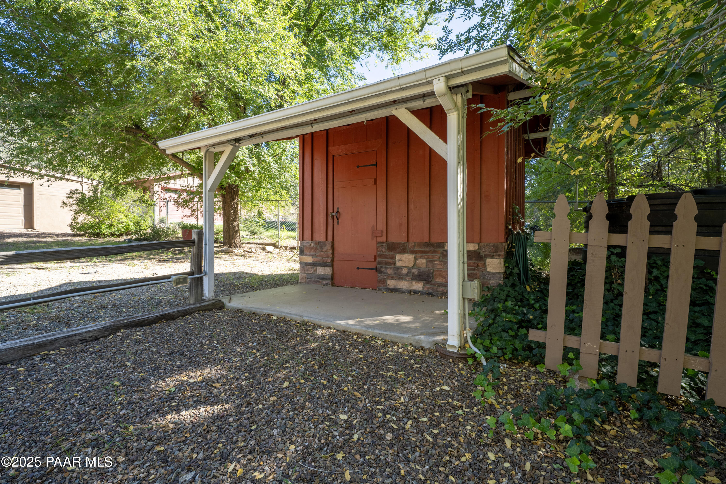 249 South Lynx Creek Road Prescott, AZ 86303 - Photo 70 of 124 a view of backyard with large trees and wooden fence