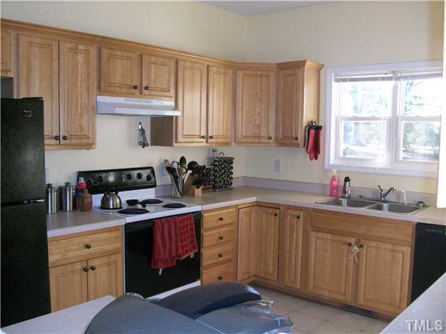 135 Ridge Road Butner, NC 27509 - Photo 16 of 25 Large kitchen with loads of cabinet space. All appliances convey!