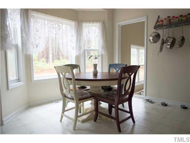 135 Ridge Road Butner, NC 27509 - Photo 19 of 25 Oversized breakfast room with large bay window overlooking wooded backyard area.