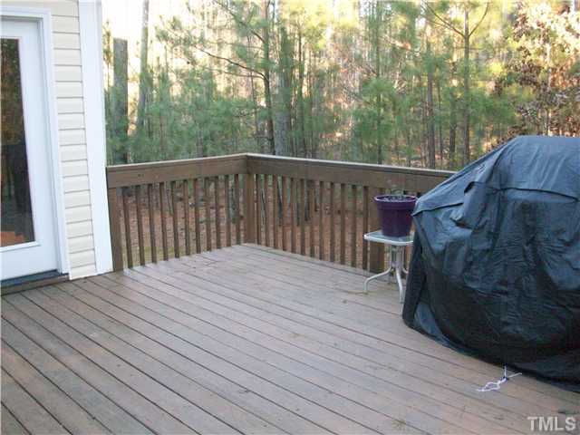 135 Ridge Road Butner, NC 27509 - Photo 20 of 25 Large deck well maintained. there is a private door leading to this deck from the Master bedroom and another door leading to the family room. Beautiful wooded view and very private.