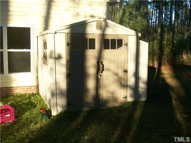 135 Ridge Road Butner, NC 27509 - Photo 22 of 25 portable garden shed conveys with the home along with the riding mower inside. Great for storing outdoor tools.