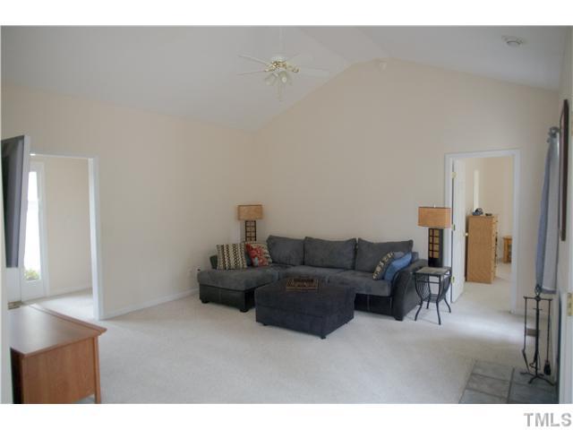 135 Ridge Road Butner, NC 27509 - Photo 5 of 25 Bright open spacious family room with cathedral ceiling and wood burning fireplace.