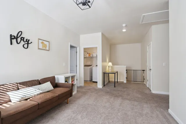 a view of a livingroom with furniture and toys