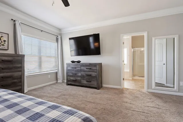 a spacious bathroom with a bathtub shower and toilet