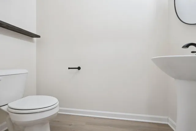a bathroom with a toilet and a sink